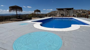 Outdoor pool, pool umbrellas, sun loungers
