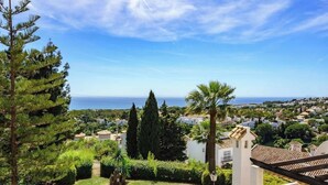 A residential area with a clear view of the sea, surrounded by greenery and white houses with red-tiled roofs. - Seaview Balcony by Costarentals - Ref 203 (Mijas)