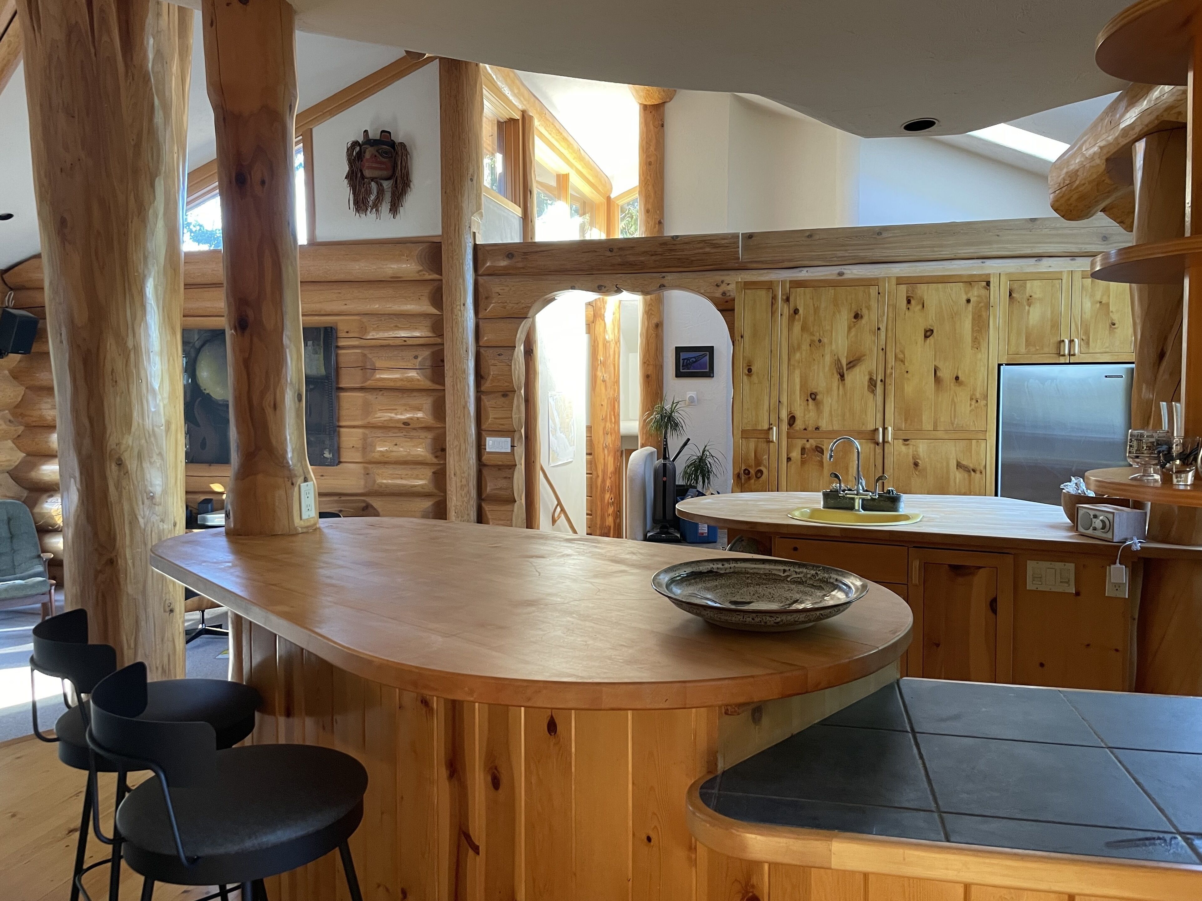 Island log home with expansive forest, lake and mountain views