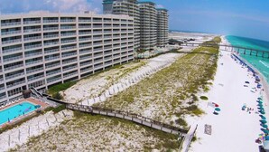 A high-rise hotel with a pool, beach access, and a pier. - Navarre Beach Regency 705 - Nama' Stay At The Beach (Navarre)