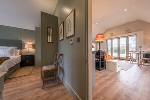 Enjoy a comfortable stay in this well-appointed space with a bed, bedside table, and desk for work.