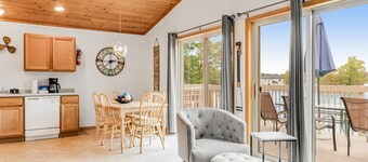 Lakefront dog-friendly condo near skiing with private beach access, views & dock