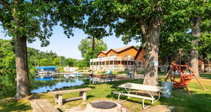 Lakefront dog-friendly condo near skiing with private beach access, views & dock