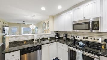 Coffee/tea maker, fridge, microwave, oven