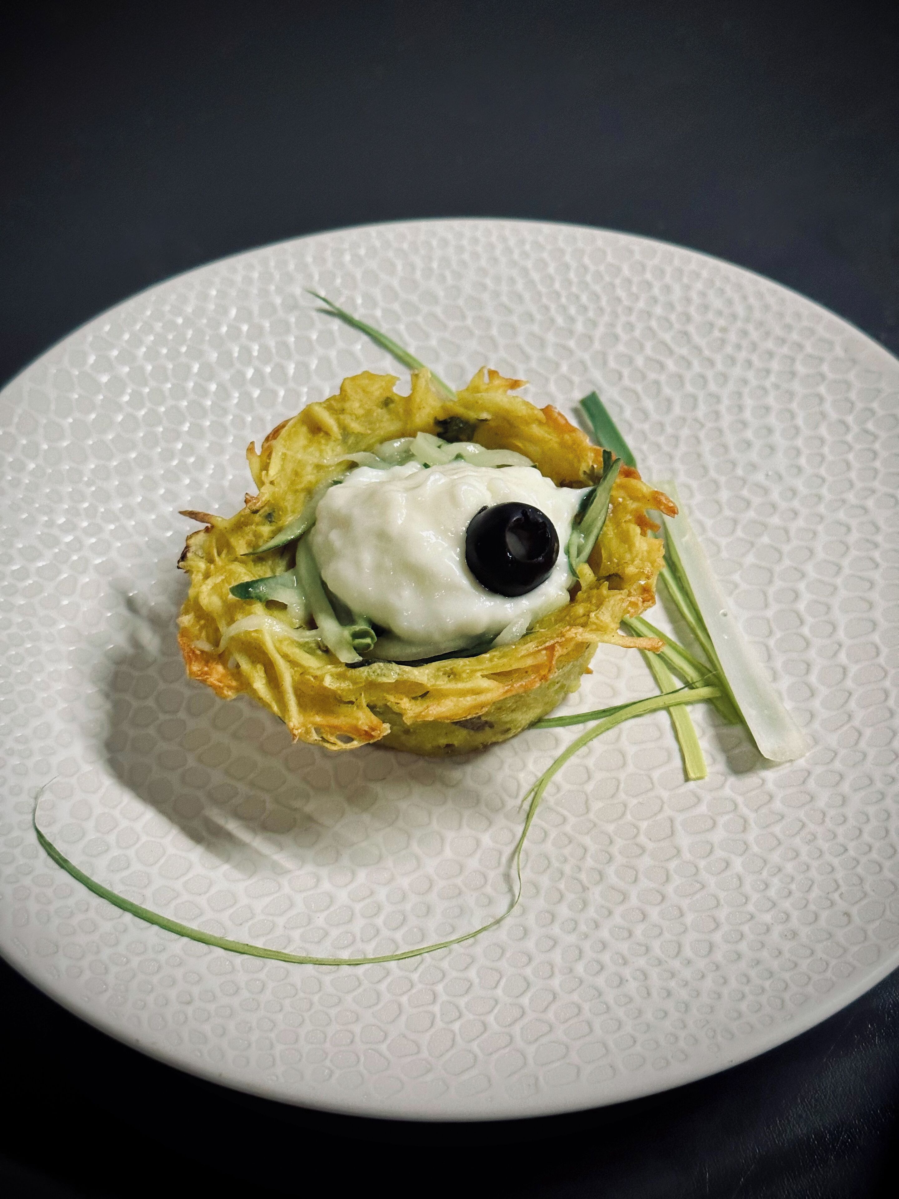 A white plate with a textured surface.