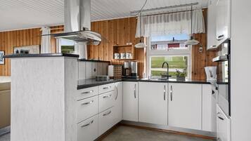 Fridge, stovetop, dishwasher, coffee/tea maker