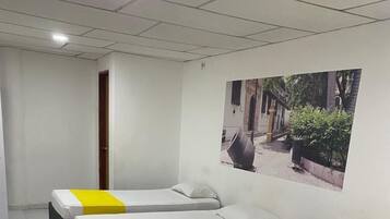 Economy Quadruple Room | Desk, bed sheets