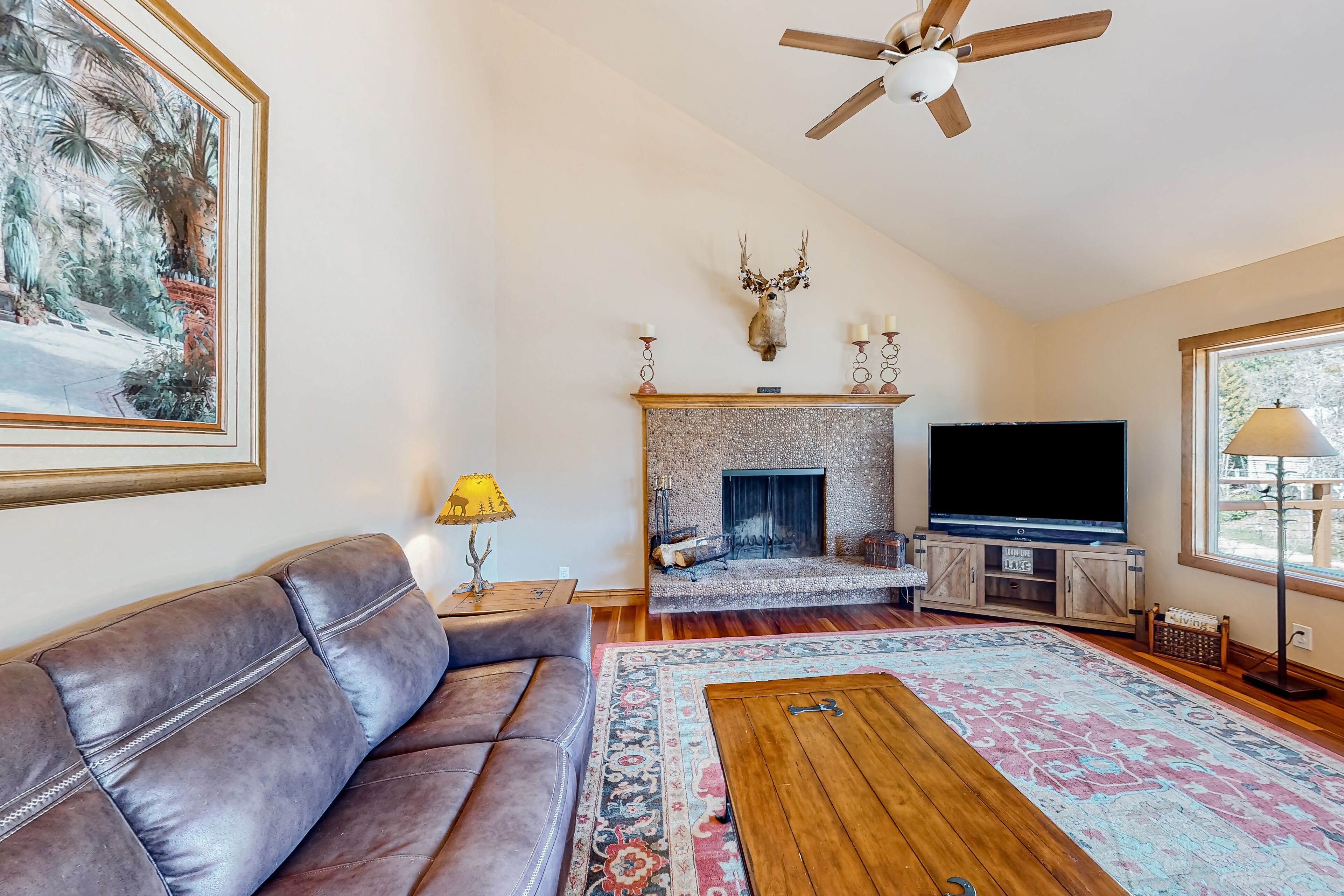 Three-story lakefront home with views, decks, hot tub, fireplaces, & game room