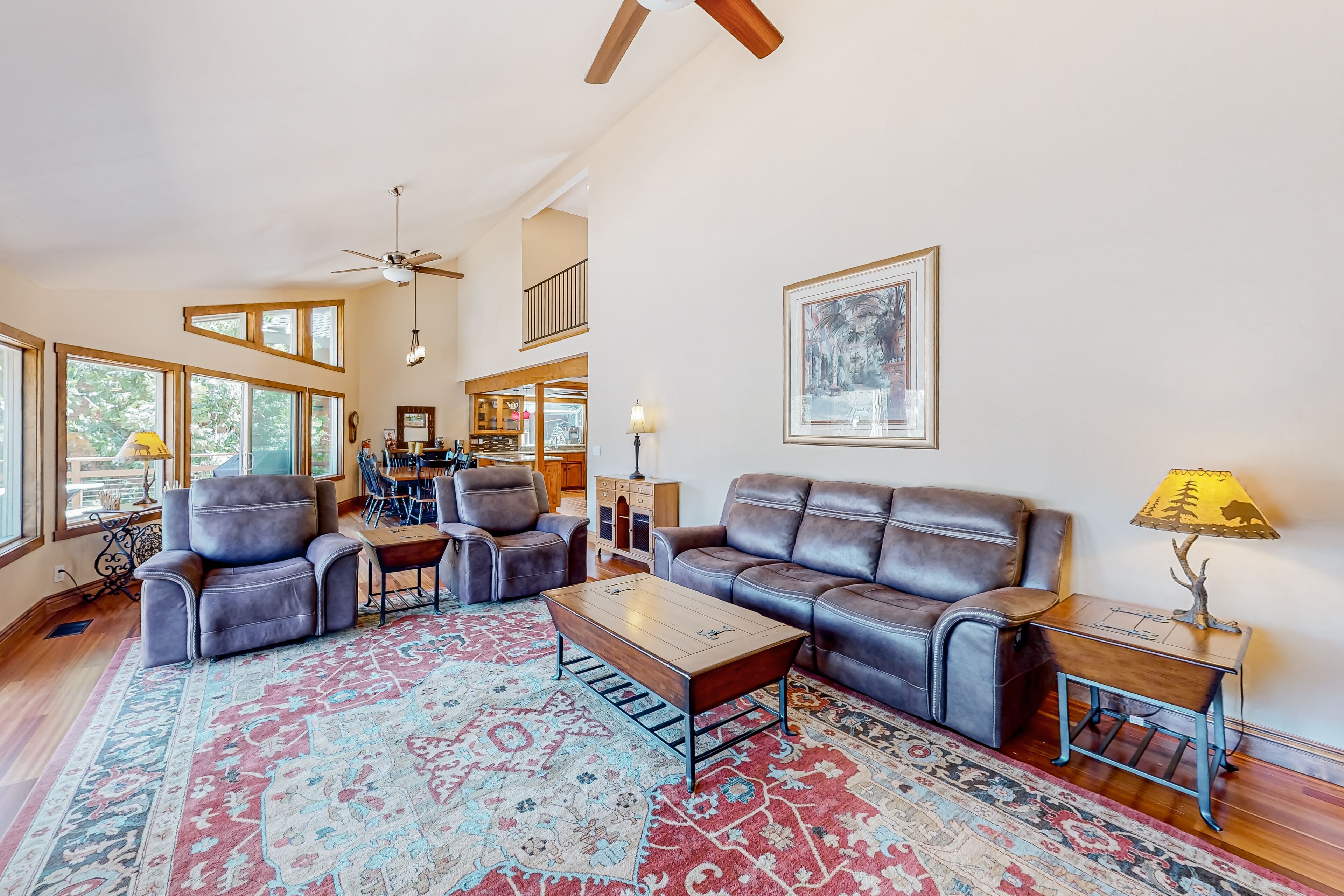 Three-story lakefront home with views, decks, hot tub, fireplaces, & game room