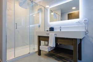 Superior Room, 1 King Bed, Non Smoking | Bathroom | Rainfall showerhead, free toiletries, hair dryer, towels