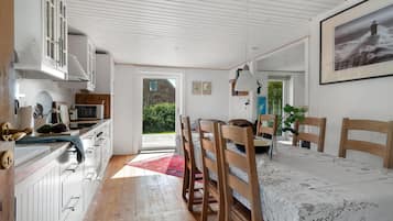 Fridge, stovetop, dishwasher, coffee/tea maker