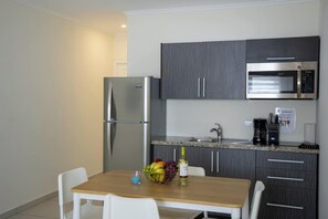 Fridge, microwave, stovetop, coffee/tea maker