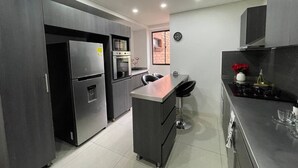 Exclusive Apartment, 4 Bedrooms, Terrace, City View | Private kitchen | Full-size fridge, microwave, oven, blender - luxury rooftop in poblado (Medellín)