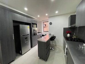 Exclusive Apartment, 4 Bedrooms, Terrace, City View | Private kitchen | Full-size fridge, microwave, oven, blender - luxury rooftop in poblado (Medellín)