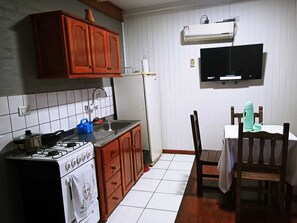 Standard Cabin, 1 Queen Bed, River View | Private kitchen | Full-size fridge, cookware/dishes/utensils, cleaning supplies - Stone Wall Cottages (Puerto Iguazú)