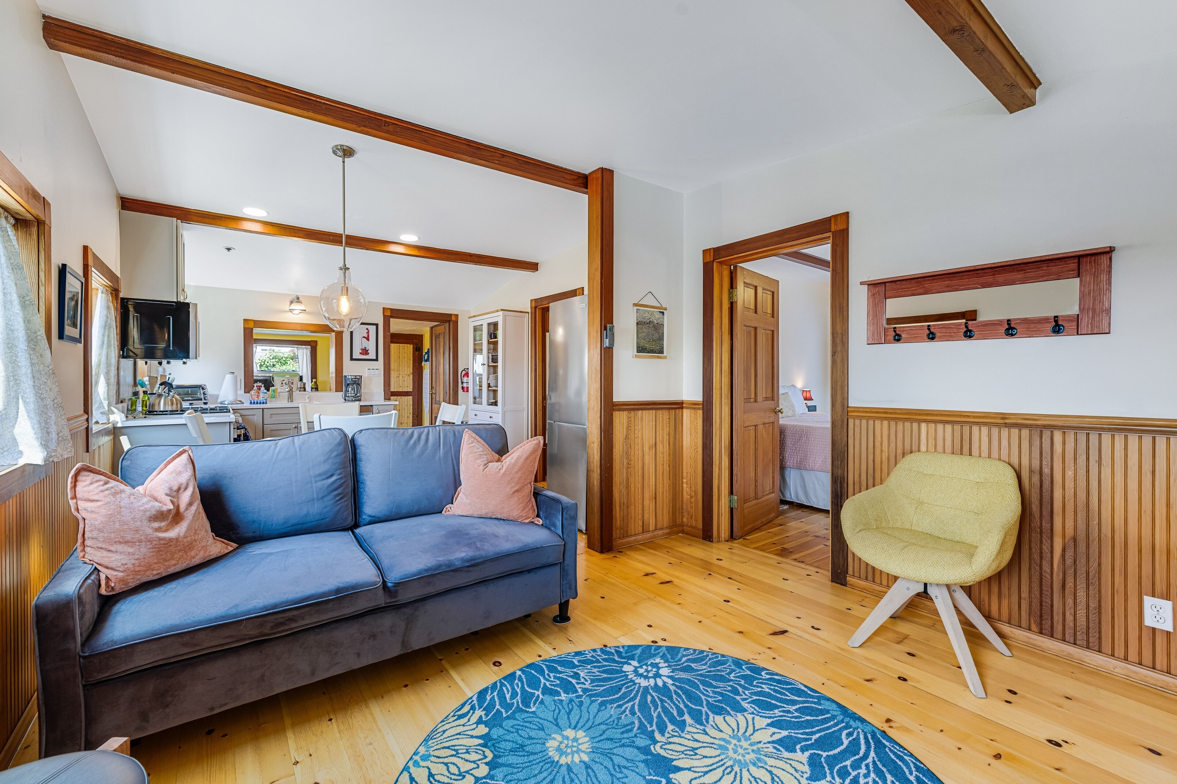 Updated, dog-friendly cottage with bay views, wraparound deck & EV charger