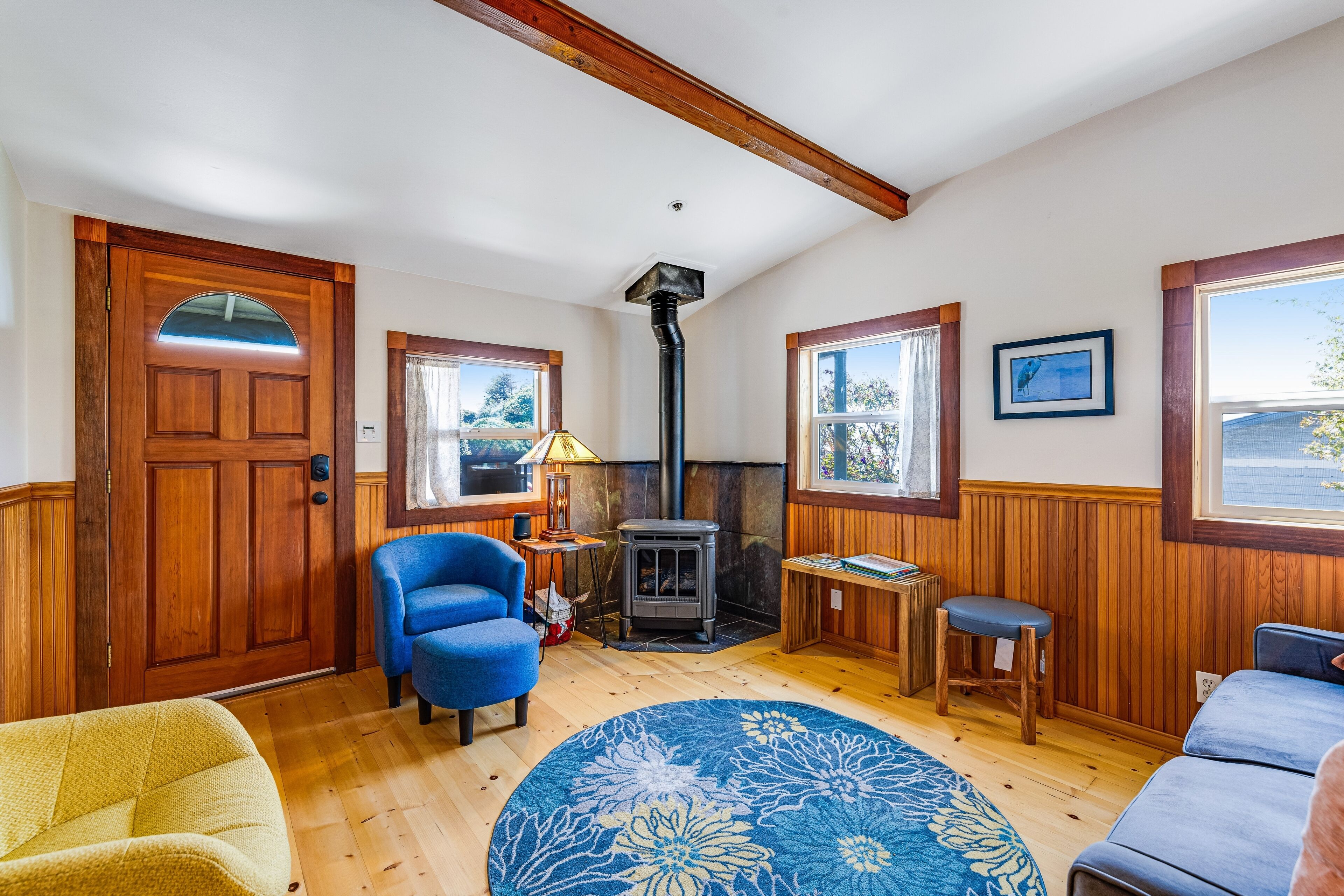 Updated, dog-friendly cottage with bay views, wraparound deck & EV charger