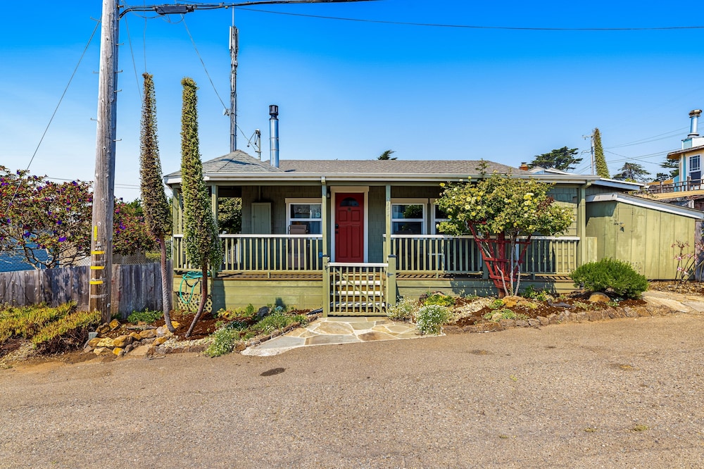 Updated, dog-friendly cottage with bay views, wraparound deck & EV charger