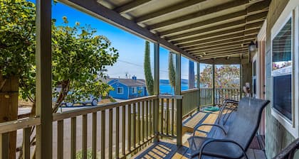 Updated, dog-friendly cottage with bay views, wraparound deck & EV charger