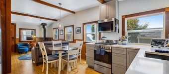 Updated, dog-friendly cottage with bay views, wraparound deck & EV charger