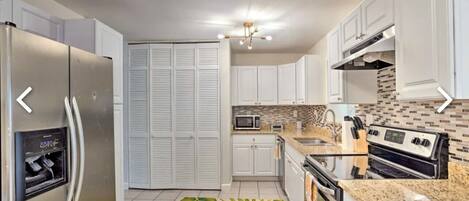 Blender, spices, ice maker, dining tables