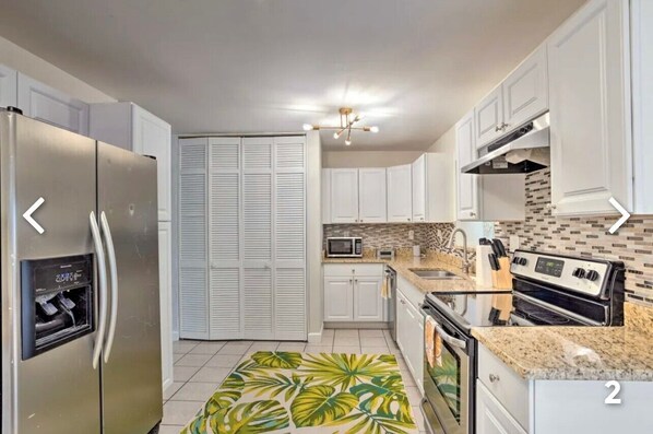 Blender, spices, ice maker, dining tables