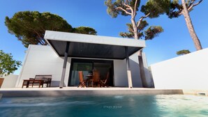 A modern house with a pool, wooden furniture, and large trees. - Villa del Fresno with pool and parking (Chiclana)