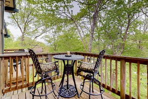 Enjoy a peaceful moment on the deck with a candlelit table for two.