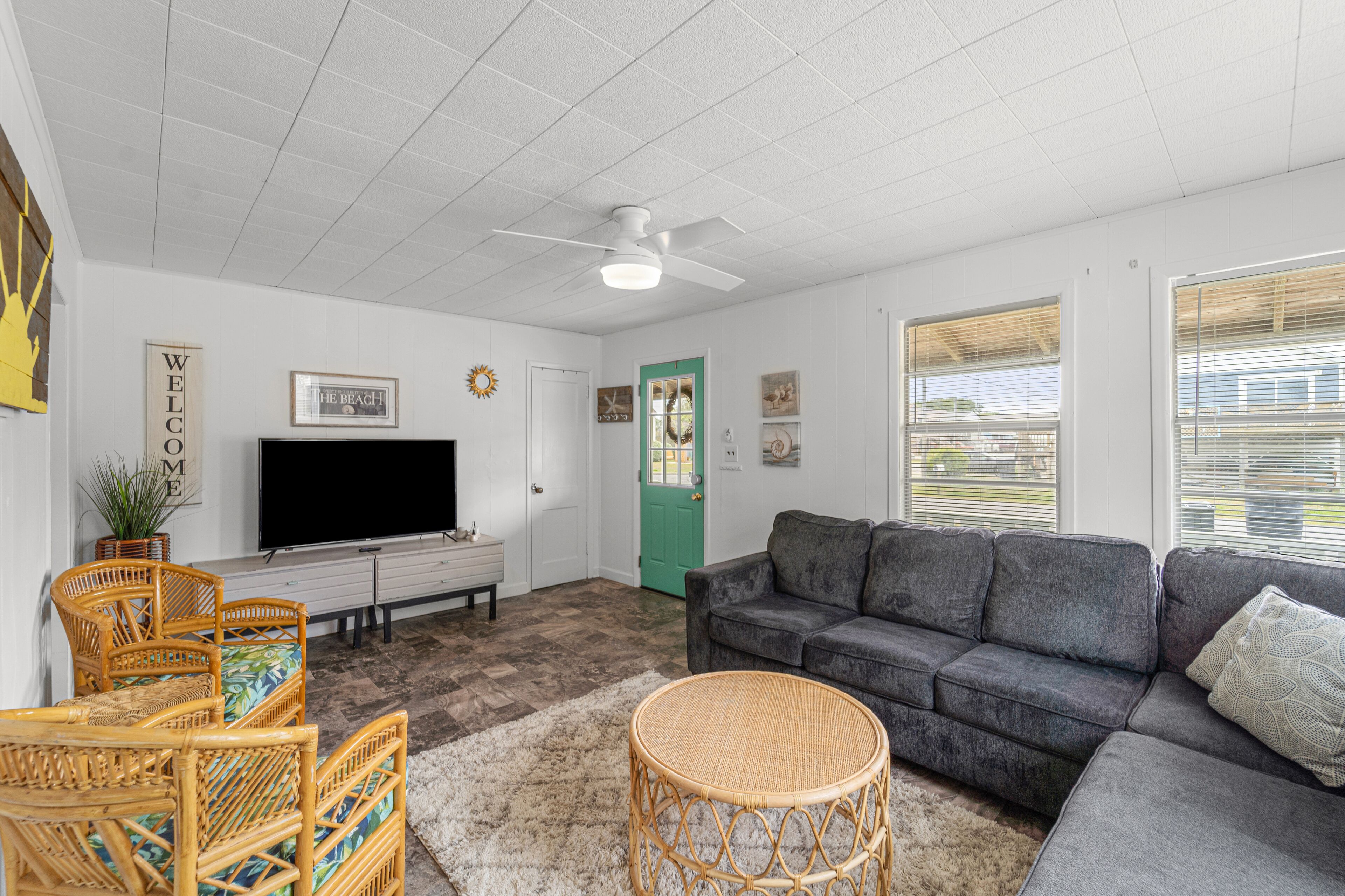 Charming coastal home with a large yard, firepit, & outdoor shower