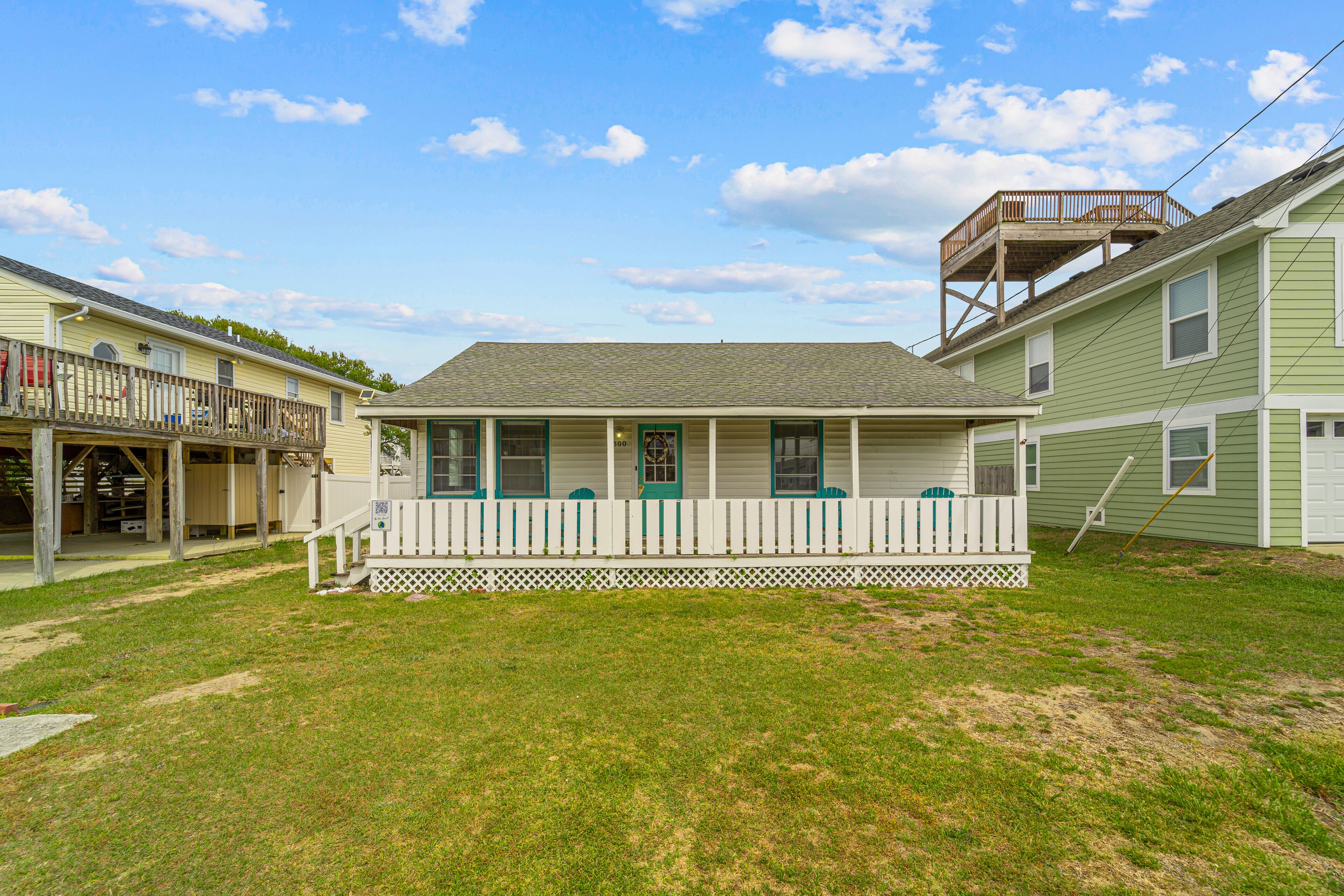 Charming coastal home with a large yard, firepit, & outdoor shower