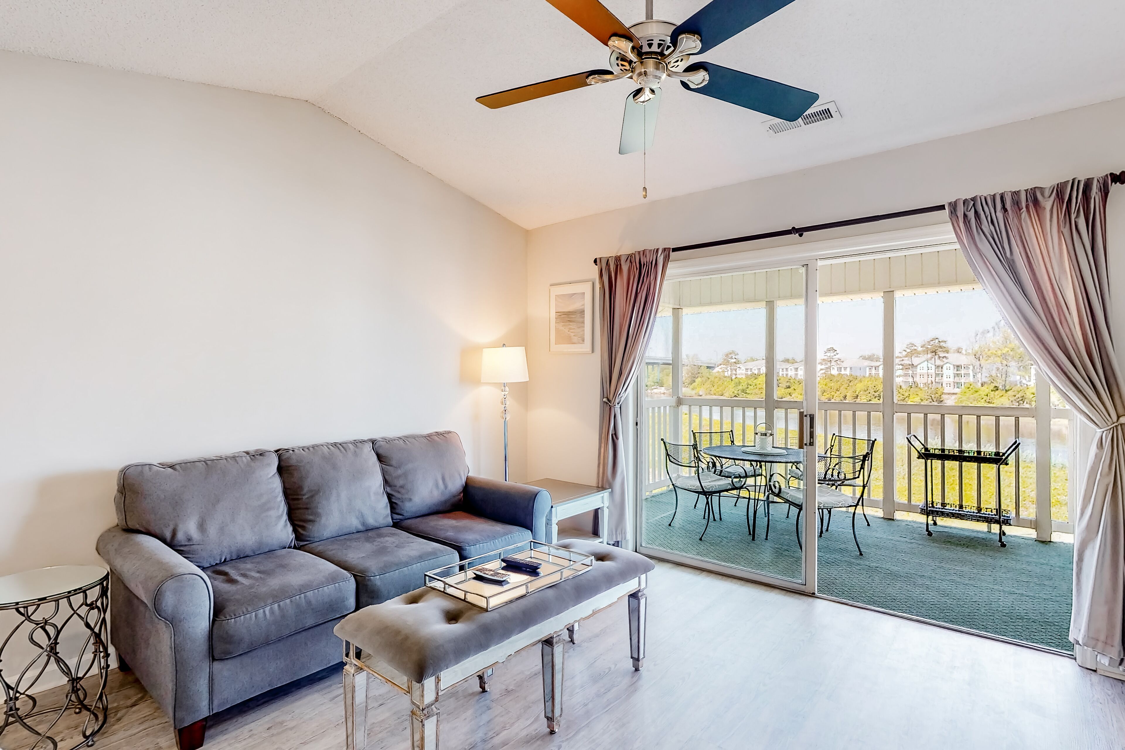 Bright condo on the water with pool, hot tub, and grill access - balcony & W/D