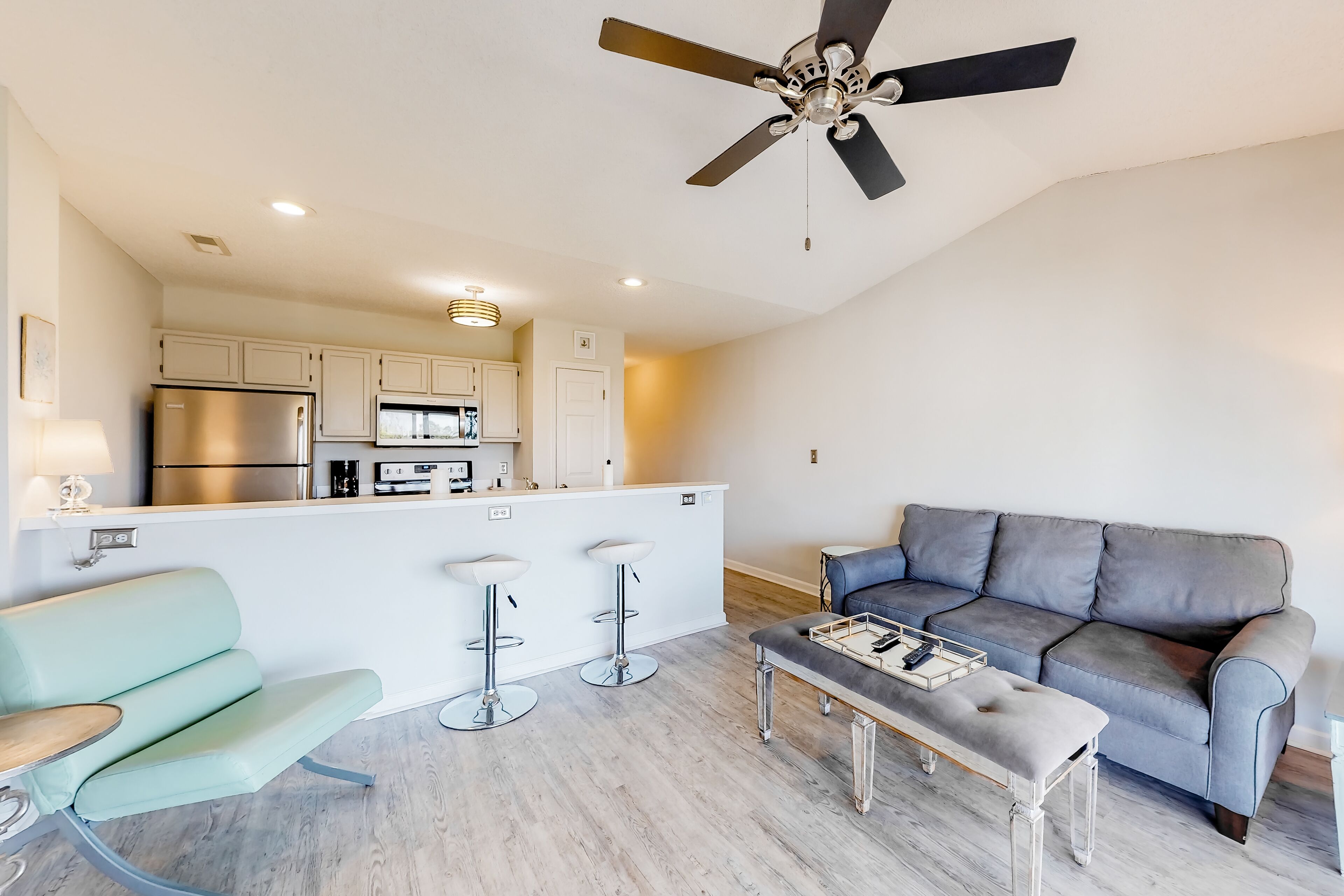 Bright condo on the water with pool, hot tub, and grill access - balcony & W/D