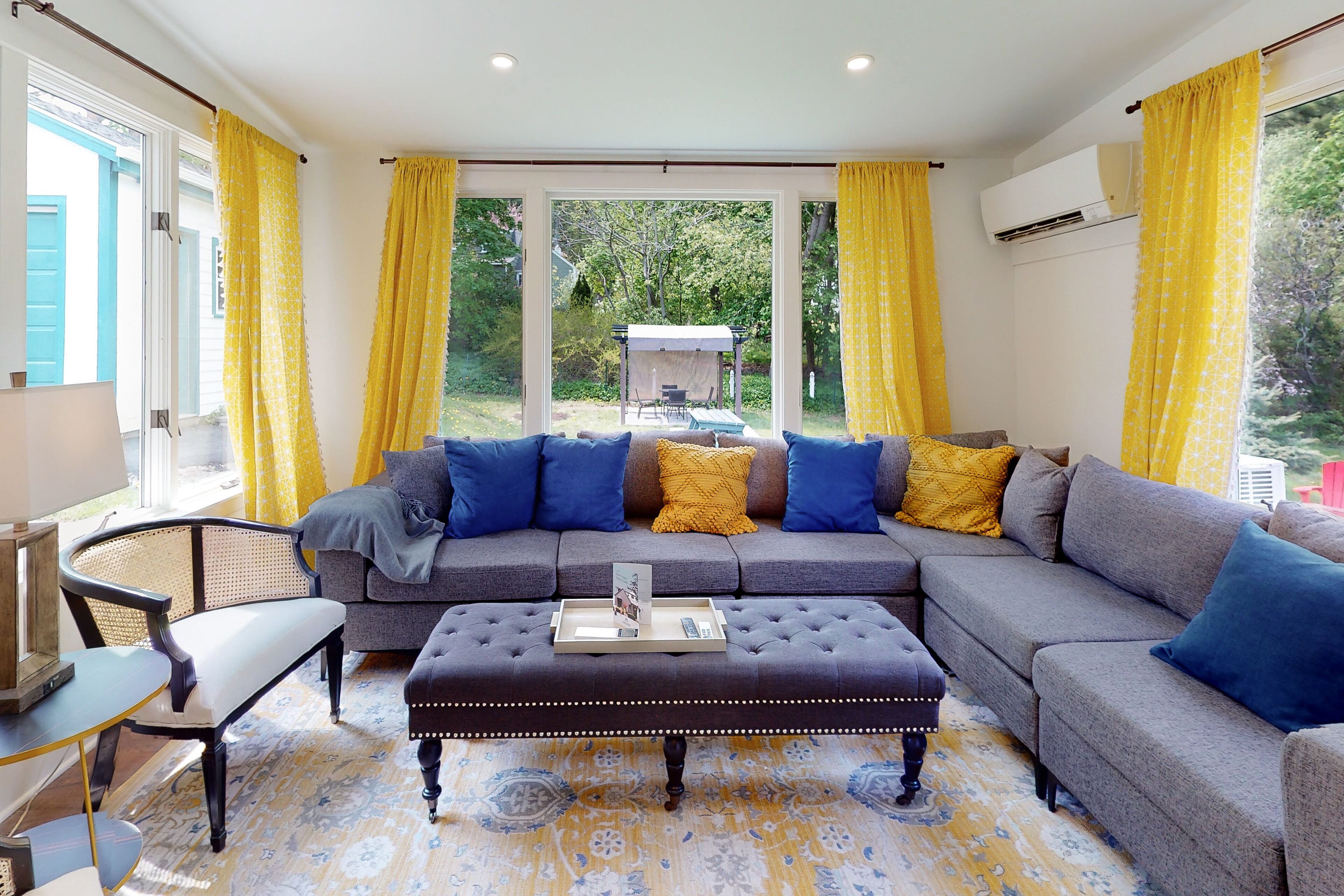 Updated, dog-friendly home with two living areas, firepit, washer/dryer, & patio