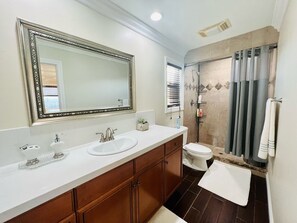 Shower, hair dryer, towels, soap