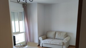 A room with a dining table, chairs, a sofa, and a chandelier. - Apartment "Jorro" with Shared Pool & Terrace (El Verger)