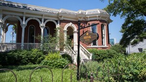 A historic building with a sign reading "Husk Restaurant."