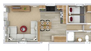 Planta baixa de um quarto de hotel com cozinha compacta, área de jantar, sala de estar, quarto e banheiro.
