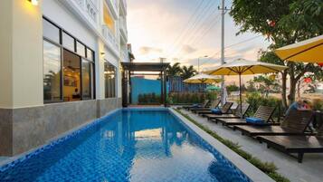 Outdoor pool, pool umbrellas, pool loungers