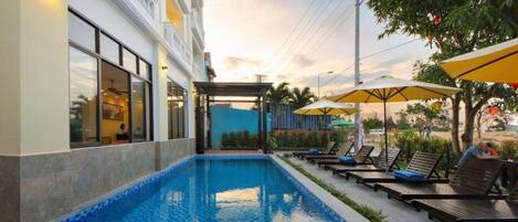 Outdoor pool, pool umbrellas, pool loungers