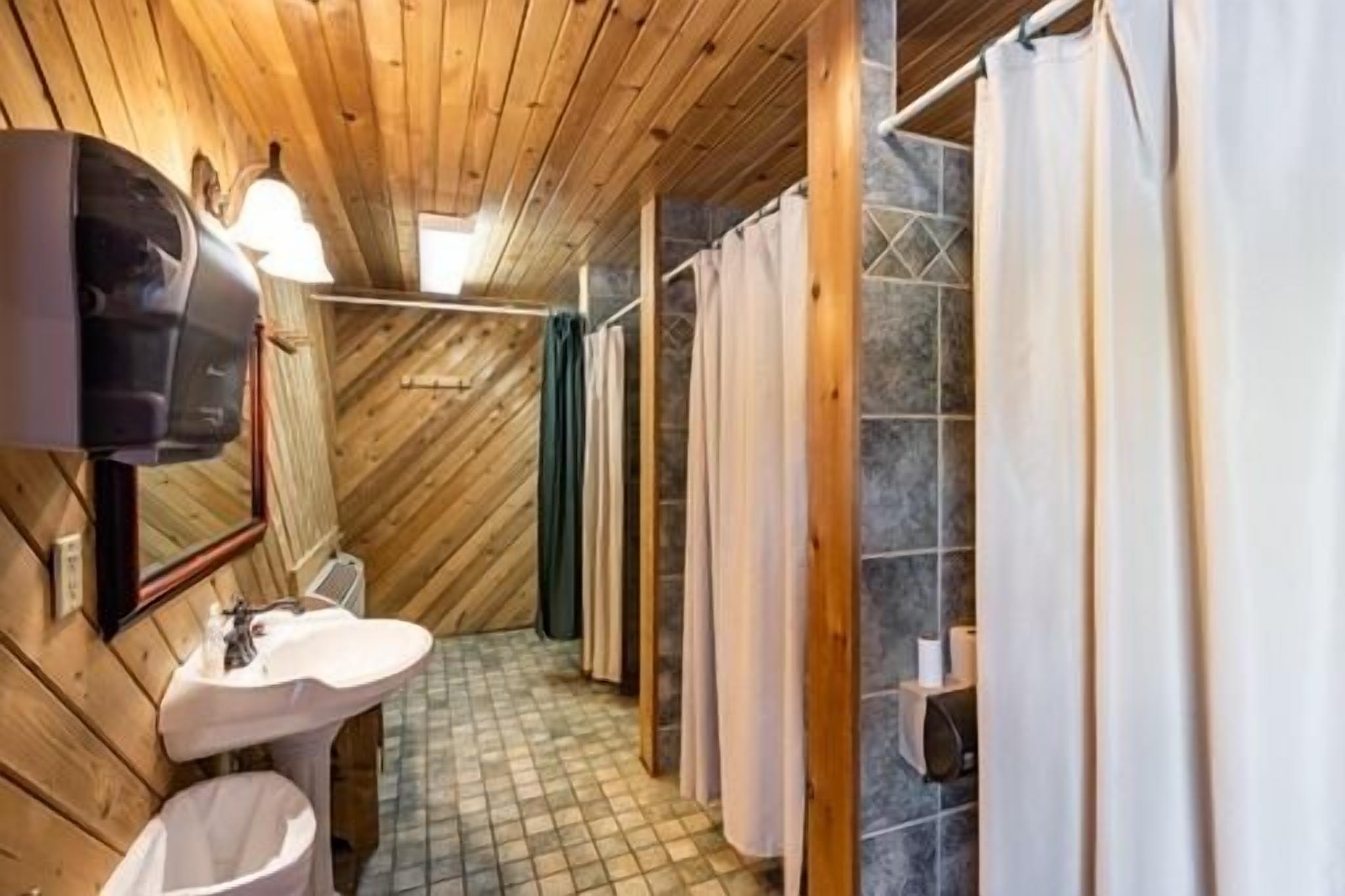 Shared bunkhouse with individual private rooms with separate toilets and showers for men and women