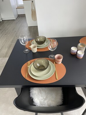 Enjoy meals in a stylish dining area with a table set for a pleasant meal.