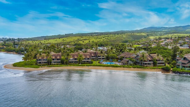 A coastal resort with beachfront villas, a pool, and lush greenery. - Breathtaking Ocean Views Kahana Village 40 2BR/2BA Condo Pool, Beach Access (lahaina)