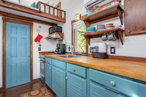 Fridge, microwave, stovetop, coffee/tea maker