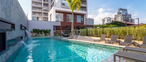 Outdoor pool, open 9:00 AM to 10:00 PM, pool loungers