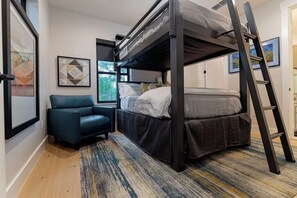 A compact room with a bunk bed, a sofa, and a ladder. - Luxury Retreat | Near Austin at Always on My Mind (Austin)