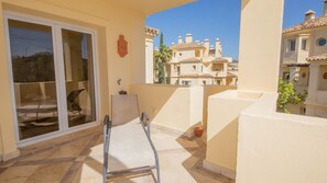 Step out onto the balcony and enjoy the view of historic buildings from the comfort of your own outdoor seating area.