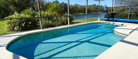 A heated pool, sun loungers