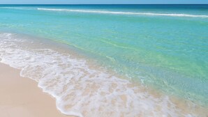 A beach with clear turquoise water and white sand. - LAST Minute Cancellation! Luxurious gorgeous condo and includes beach service! (Panama City Beach)