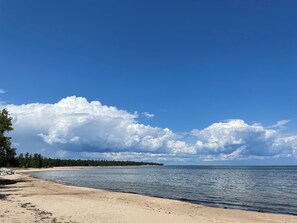 On the beach, sun-loungers, beach towels