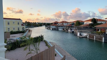 A waterfront property with multiple overwater bungalows connected by walkways.